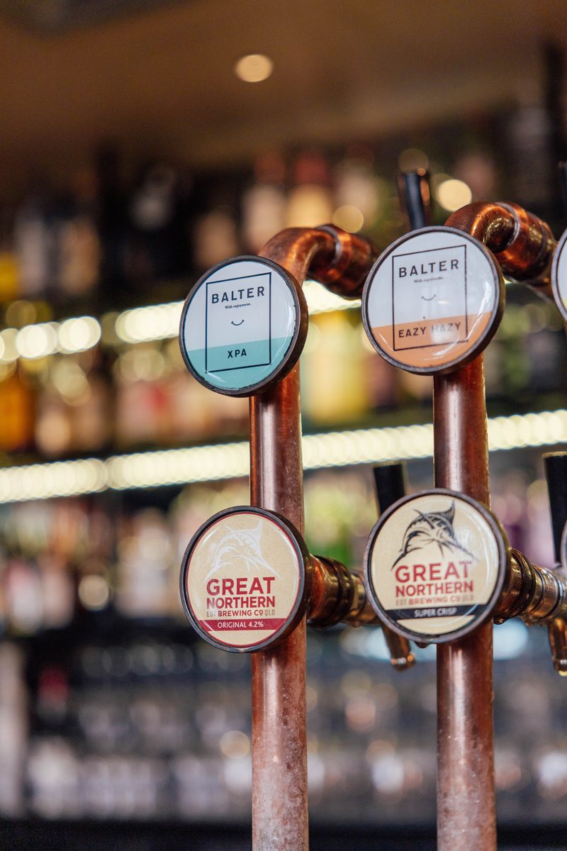 Tap beer handles on the bar at The Rock Toowoomba