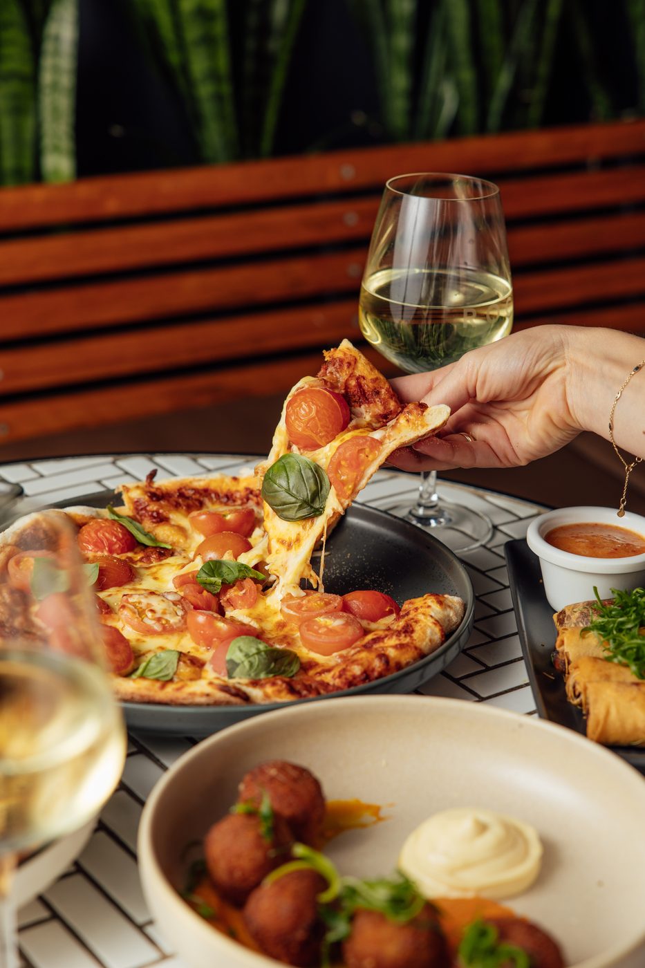 A slice of margherita pizza being lifted from the board at The Rock Toowoomba