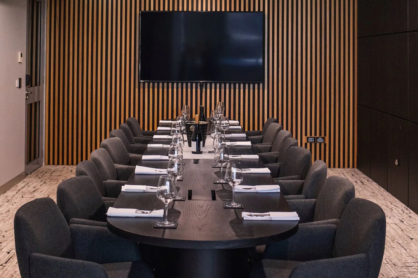 The boardroom at The Rock set for a meeting with a large screen